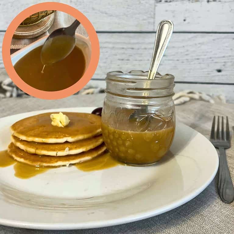 A plate with a mini mason jar filled with brown sugar sauce sits beside 3 pancakes covered in the sauce and a few grapes. At the top left is a circle with an image inside of it of a pitcher filled with brown sugar sauce.